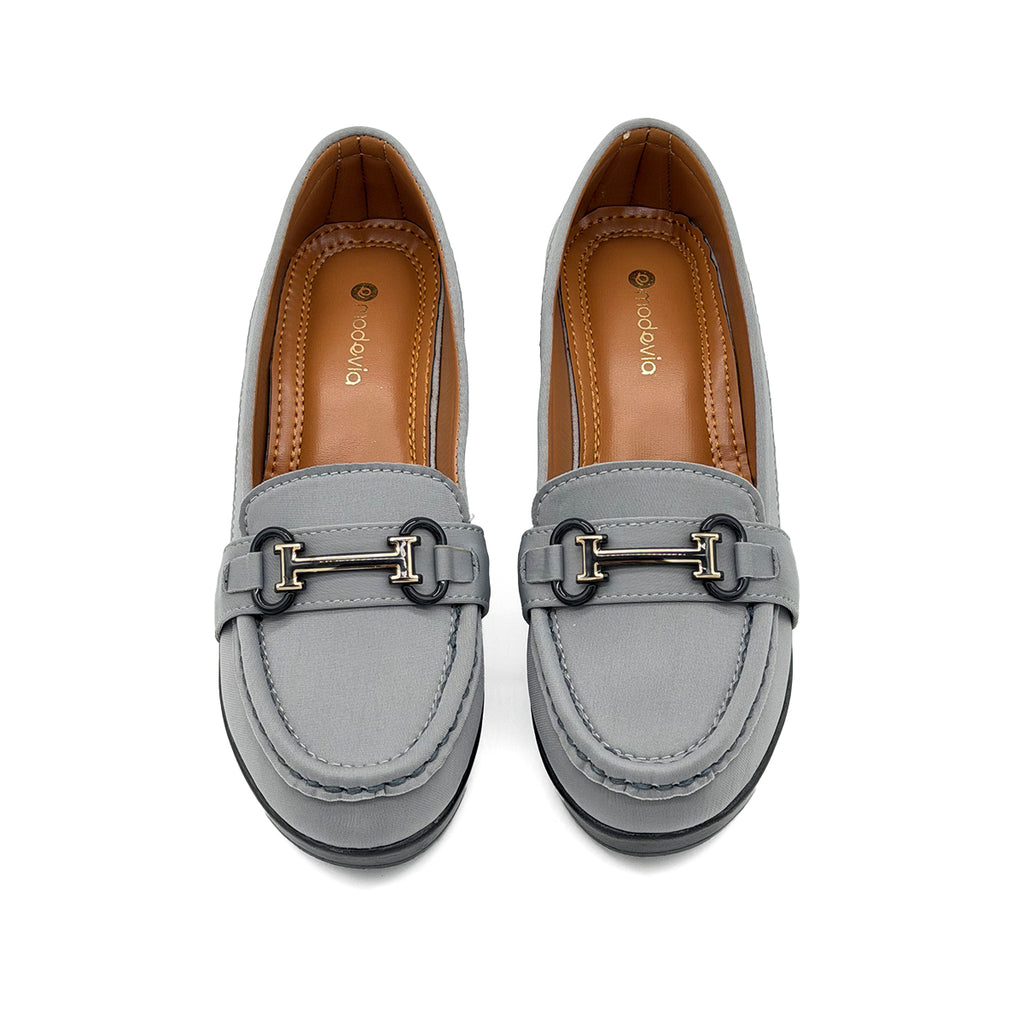 Pair of gray loafers with a gold buckle on a white background