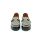 Pair of gray loafers with black soles on a white background
