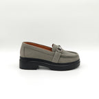 Gray loafer shoe with a black sole on a white background