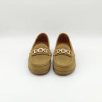 Pair of tan loafers with gold accents on a white background